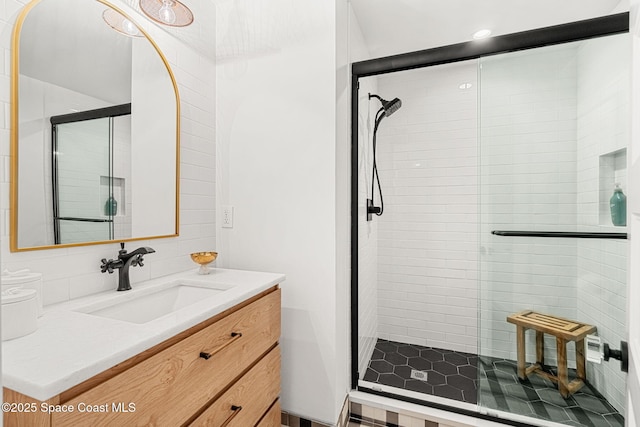2600 N Riverside Dr, Indialantic, FL 32903 - bathroom with vanity, a stall shower, and recessed lighting