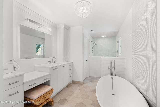 2600 N Riverside Dr, Indialantic, FL 32903 - bathroom featuring vanity, a freestanding bath, a tile shower, tile patterned flooring, and a chandelier