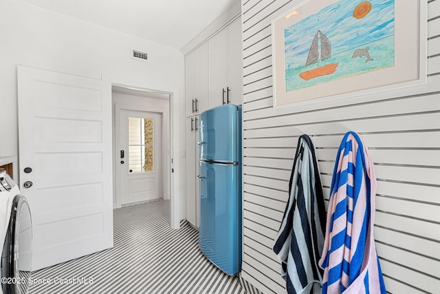 2600 N Riverside Dr, Indialantic, FL 32903 - property entrance with independent washer and dryer