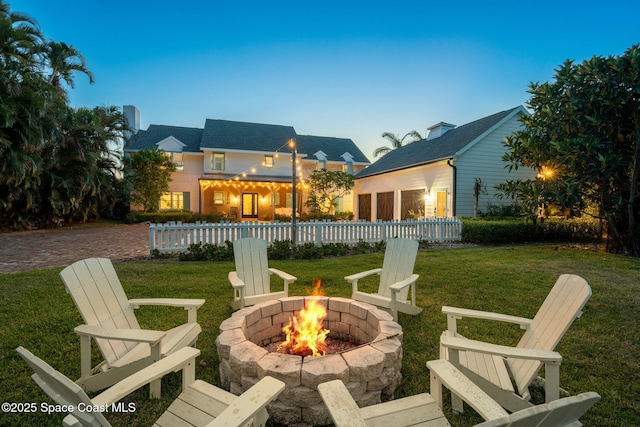 2600 N Riverside Dr, Indialantic, FL 32903 - view of grassy yard with an outdoor fire pit