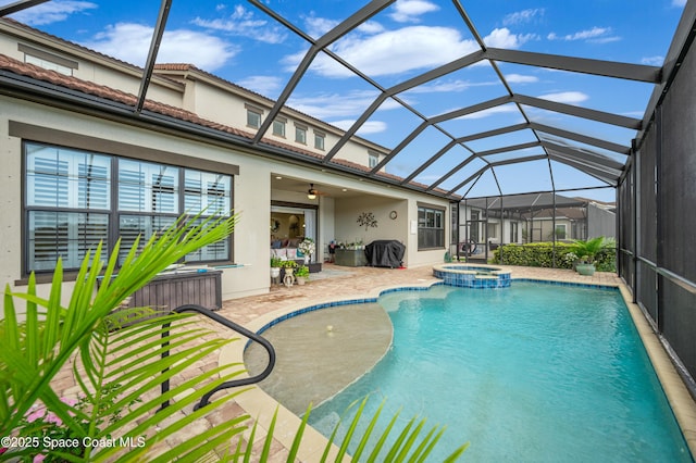 7873 Desmond Ave, Melbourne, FL 32940 - view of swimming pool featuring a patio, a pool with connected hot tub, a ceiling fan, and glass enclosure