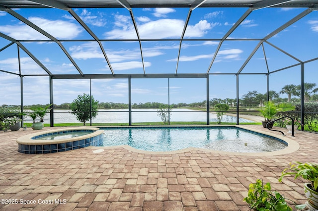 7873 Desmond Ave, Melbourne, FL 32940 - view of swimming pool with a lanai, a pool with connected hot tub, a patio, and a water view