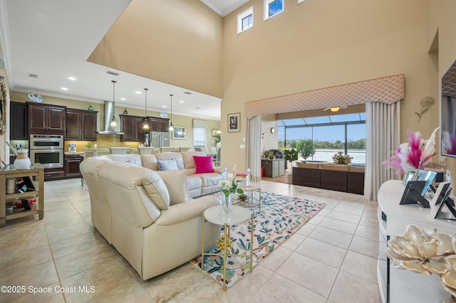 7873 Desmond Ave, Melbourne, FL 32940 - living area with ornamental molding, plenty of natural light, light tile patterned flooring, a water view, and recessed lighting