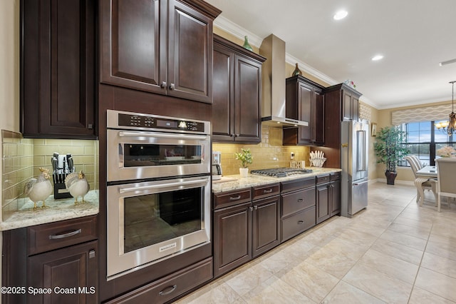 7873 Desmond Ave, Melbourne, FL 32940 - kitchen featuring stainless steel appliances, crown molding, a chandelier, dark brown cabinetry, and backsplash