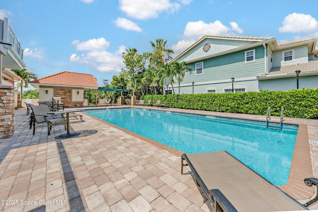 1375 Isabella Dr Unit 108, Melbourne, FL 32935 - community pool featuring a patio area and an outdoor structure