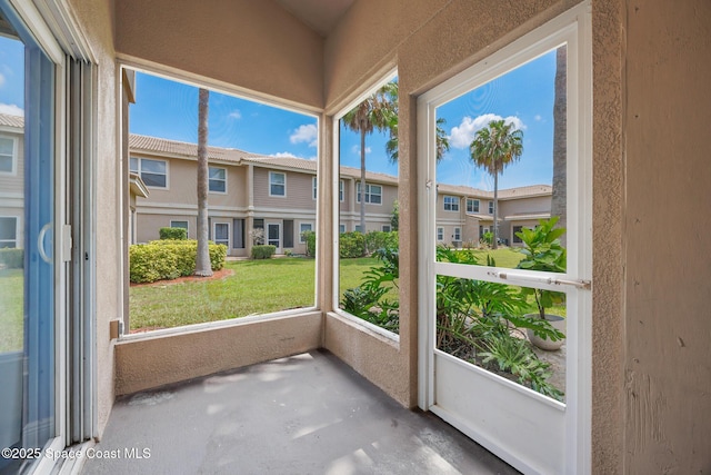 1375 Isabella Dr Unit 108, Melbourne, FL 32935 - unfurnished sunroom featuring a residential view