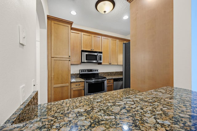 1375 Isabella Dr Unit 108, Melbourne, FL 32935 - kitchen with stainless steel appliances and dark stone counters