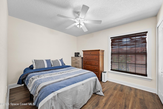 1375 Isabella Dr Unit 108, Melbourne, FL 32935 - bedroom with wood finished floors, a textured ceiling, and ceiling fan