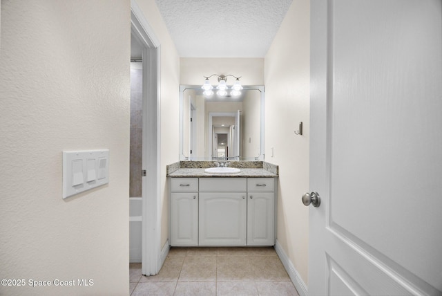 1375 Isabella Dr Unit 108, Melbourne, FL 32935 - bathroom featuring vanity, tile patterned floors, and a textured ceiling