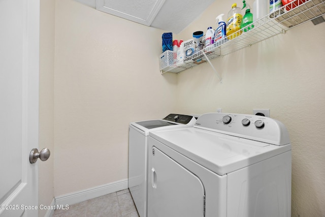 1375 Isabella Dr Unit 108, Melbourne, FL 32935 - washroom featuring washer and dryer and light tile patterned flooring