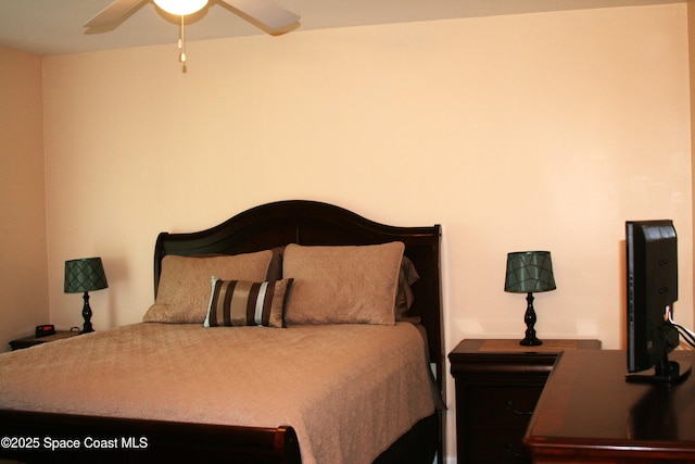 201 Saint Lucie Ln Unit 309, Cocoa Beach, FL 32931 - bedroom featuring a ceiling fan