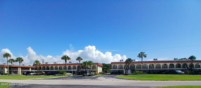 201 Saint Lucie Ln Unit 309, Cocoa Beach, FL 32931 - view of property featuring uncovered parking