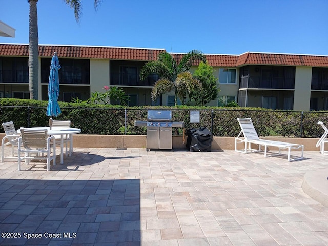 201 Saint Lucie Ln Unit 309, Cocoa Beach, FL 32931 - view of patio / terrace with grilling area