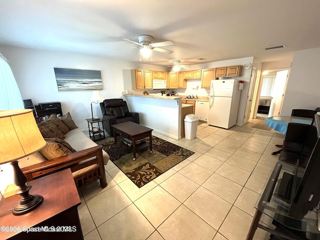 201 Saint Lucie Ln Unit 309, Cocoa Beach, FL 32931 - living room featuring light tile patterned floors and ceiling fan