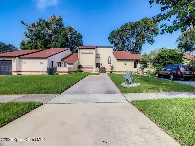 694 Golden Sunshine Cir, Orlando, FL 32807 - view of front of property with a front yard and stucco siding