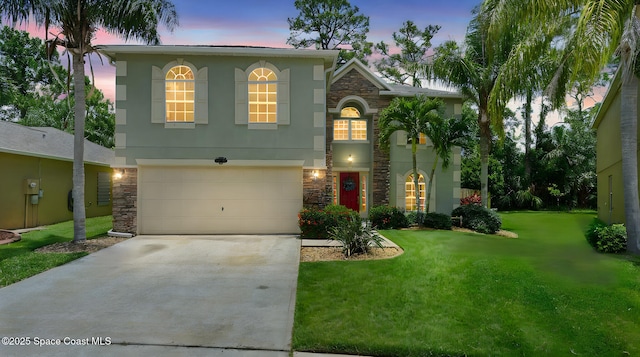 4060 Aria Dr, Melbourne, FL 32904 - view of front of property with stone siding, driveway, and an attached garage