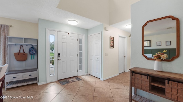 4060 Aria Dr, Melbourne, FL 32904 - entryway featuring light tile patterned flooring and baseboards
