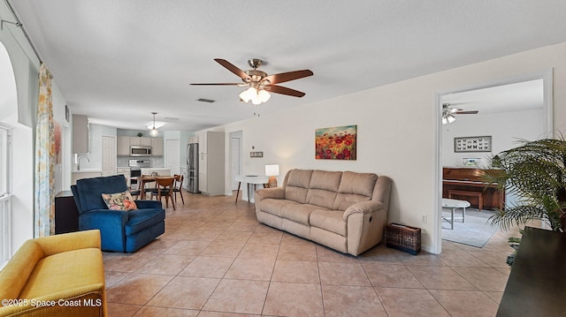 4060 Aria Dr, Melbourne, FL 32904 - living area featuring a ceiling fan and light tile patterned floors