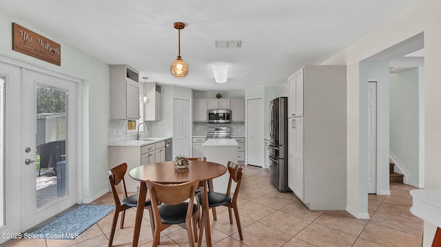 4060 Aria Dr, Melbourne, FL 32904 - dining area with light tile patterned floors and stairway