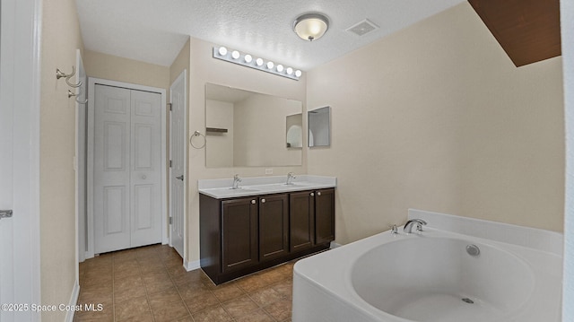 4060 Aria Dr, Melbourne, FL 32904 - full bath with a bath, double vanity, a closet, and tile patterned flooring