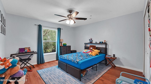 4060 Aria Dr, Melbourne, FL 32904 - bedroom with wood finished floors and ceiling fan