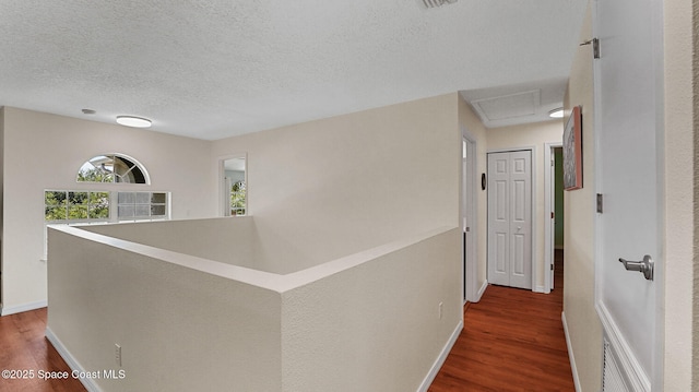 4060 Aria Dr, Melbourne, FL 32904 - hall with wood finished floors and a textured ceiling