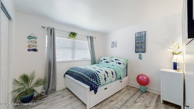 210 Cleveland Ave Unit 210, Cocoa Beach, FL 32931 - bedroom with wood finished floors and baseboards