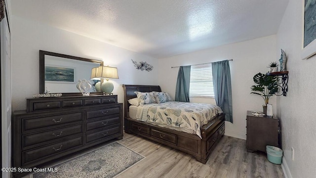 210 Cleveland Ave Unit 210, Cocoa Beach, FL 32931 - bedroom featuring light wood-style floors