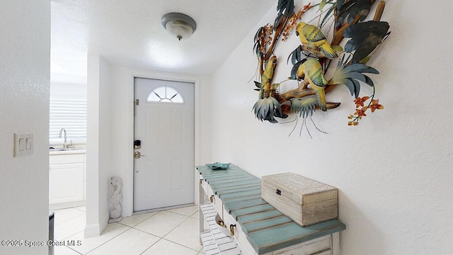 210 Cleveland Ave Unit 210, Cocoa Beach, FL 32931 - entryway with light tile patterned floors and a textured ceiling