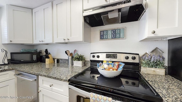 212 Cleveland Ave Unit 212, Cocoa Beach, FL 32931 - kitchen with stainless steel appliances, exhaust hood, white cabinets, and stone countertops