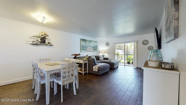 212 Cleveland Ave Unit 212, Cocoa Beach, FL 32931 - dining room featuring dark wood-type flooring and a textured ceiling