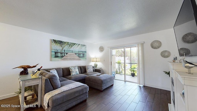 212 Cleveland Ave Unit 212, Cocoa Beach, FL 32931 - living room with dark wood-style flooring and baseboards