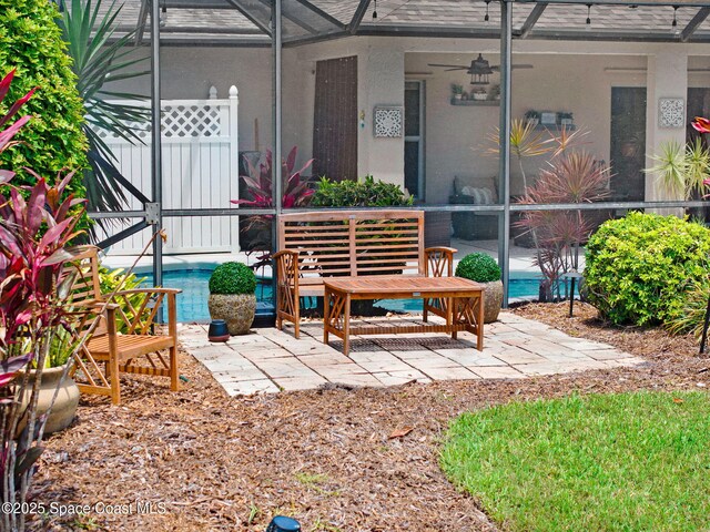 1137 White Oak Cir, Melbourne, FL 32934 - view of patio / terrace with a ceiling fan, a lanai, and an outdoor pool