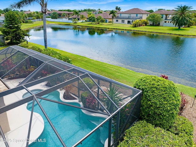 1137 White Oak Cir, Melbourne, FL 32934 - view of swimming pool featuring glass enclosure, a water view, an infinity pool, a patio, and a yard