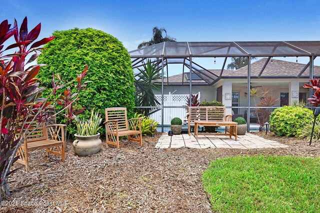 1137 White Oak Cir, Melbourne, FL 32934 - rear view of house featuring a patio area and glass enclosure