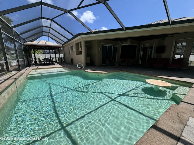 1351 Tamango Dr, Melbourne, FL 32904 - swimming pool with ceiling fan, a patio area, and a lanai