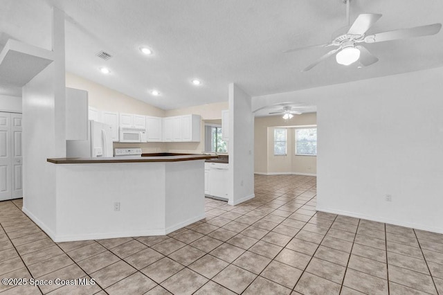 461 Coply Ter, Sebastian, FL 32958 - kitchen featuring white appliances, dark countertops, white cabinetry, ceiling fan, and light tile patterned floors