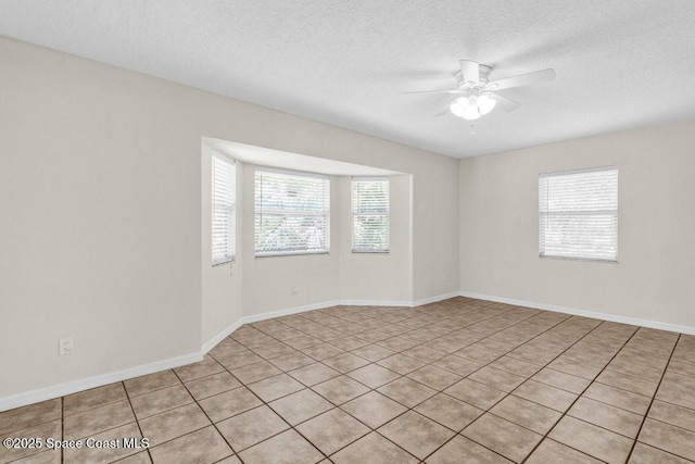 461 Coply Ter, Sebastian, FL 32958 - spare room with ceiling fan, a textured ceiling, and light tile patterned flooring