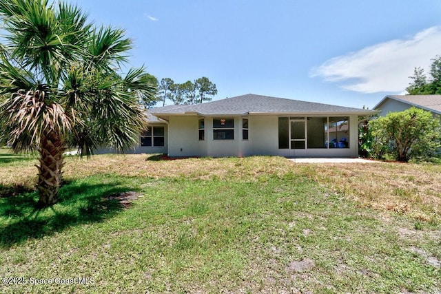 461 Coply Ter, Sebastian, FL 32958 - rear view of property with stucco siding, a yard, and a sunroom