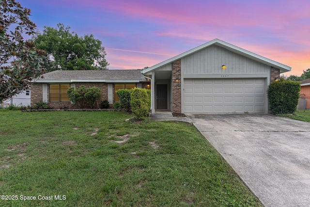 1337 Pakenham St NW, Palm Bay, FL 32907 - view of front of house featuring brick siding, driveway, a garage, and a lawn