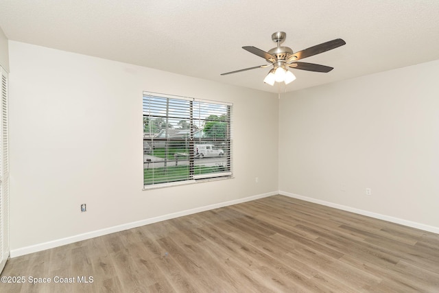 1337 Pakenham St NW, Palm Bay, FL 32907 - unfurnished room with light wood finished floors and a ceiling fan