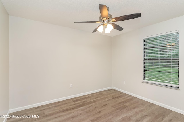 1337 Pakenham St NW, Palm Bay, FL 32907 - empty room with light wood-style floors and ceiling fan