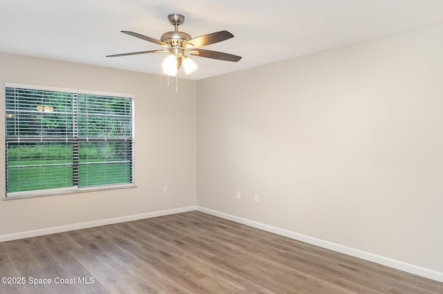 1337 Pakenham St NW, Palm Bay, FL 32907 - spare room with wood finished floors and ceiling fan