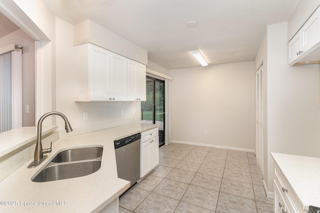 1337 Pakenham St NW, Palm Bay, FL 32907 - kitchen featuring dishwasher, white cabinetry, a textured ceiling, light tile patterned floors, and light stone countertops