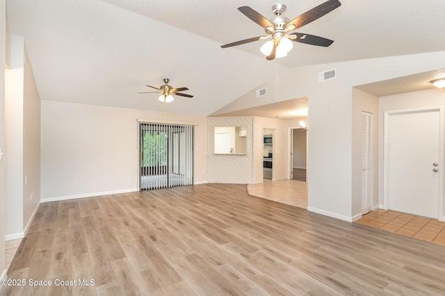 1337 Pakenham St NW, Palm Bay, FL 32907 - unfurnished living room with ceiling fan, lofted ceiling, and light wood-style floors