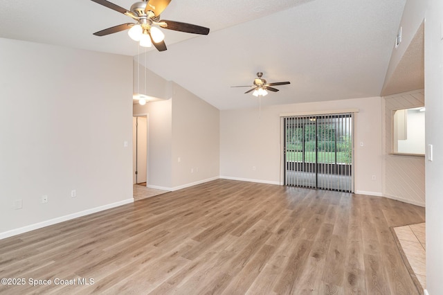 1337 Pakenham St NW, Palm Bay, FL 32907 - empty room featuring ceiling fan, lofted ceiling, and light wood finished floors