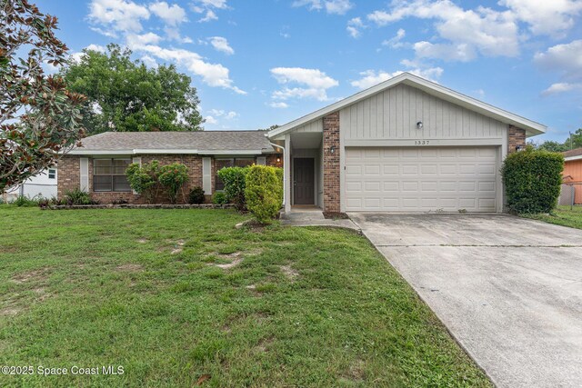 1337 Pakenham St NW, Palm Bay, FL 32907 - view of front of house featuring brick siding, concrete driveway, a garage, and a front lawn