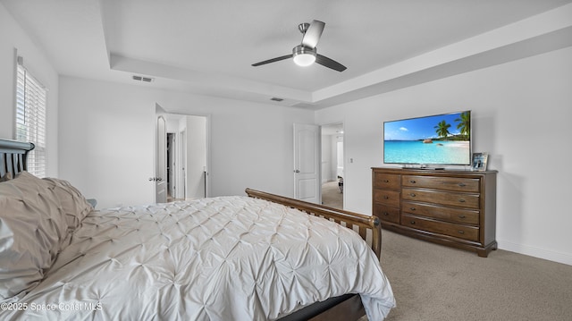 6830 Harp Ave, Cocoa, FL 32927 - carpeted bedroom featuring a raised ceiling and ceiling fan