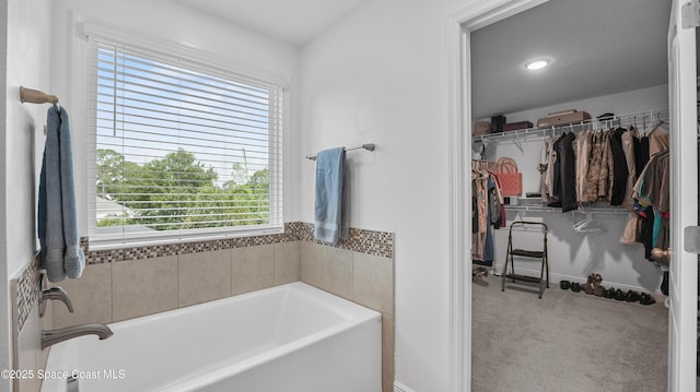 6830 Harp Ave, Cocoa, FL 32927 - full bathroom featuring a garden tub and a spacious closet