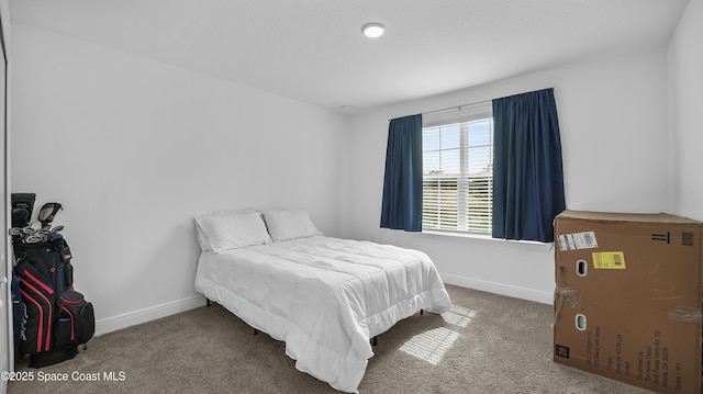 6830 Harp Ave, Cocoa, FL 32927 - carpeted bedroom featuring baseboards